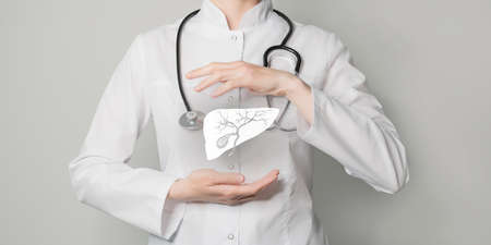 Gall bladder issues medical concept. Photo of female doctor, empty space.の写真素材