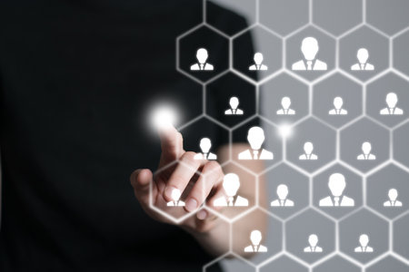 Human resources manager pointing at virtual network chain with person icons. Human capital and teambuilding concept.の写真素材