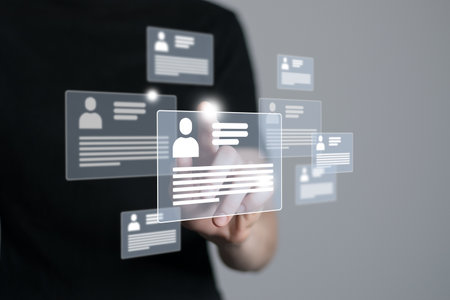 Woman`s hand pointing on highlighted cv cards with candidates information. Human resources concept.Illustrative material for articles and web.の写真素材