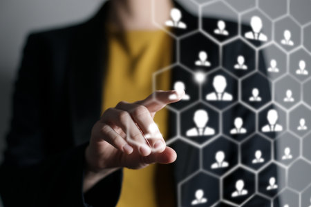 Human resources manager pointing at virtual network chain with person icons. Human capital and teambuilding concept.の写真素材