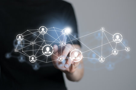 Human resources manager pointing at virtual network chain with person icons. Human capital and teambuilding concept.の写真素材