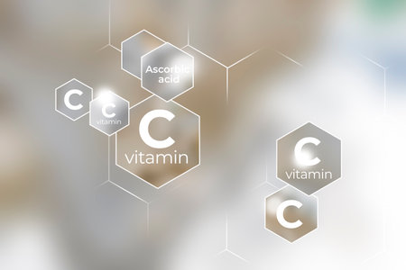 Immunity protection concept, vitamin C. Hexagons with Vitamin C name, blurry background.の写真素材