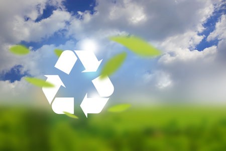 White icon representing the ecological call to recycle and reuse package on bokeh background of green fresh nature. Clean future and recycle concept.の写真素材