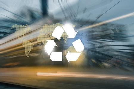 Big city road and tram way, recycle symbol and planet continents on bokeh background. Clean future and recycle concept.の写真素材