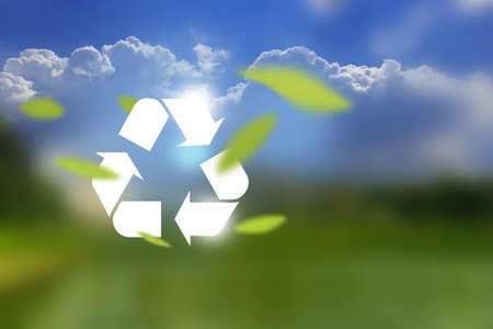 White icon representing the ecological call to recycle and reuse package on bokeh background of green fresh nature. Clean future and recycle concept.の写真素材