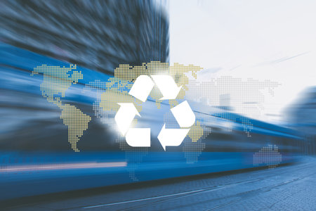 Big city road and tram way, recycle symbol and planet continents on bokeh background. Clean future and recycle concept.の写真素材