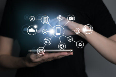 Woman using smartphone with icons expressing multitasking. Digital software technology development conceptの写真素材