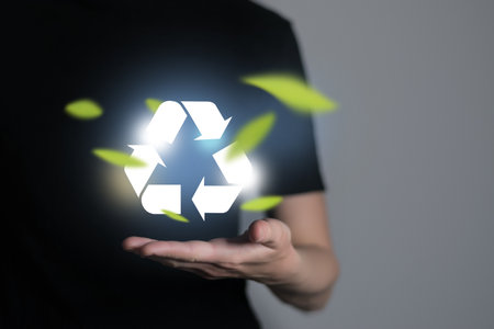 Woman holding abstract recycle sign. Global ecological responsibility and clean future concept.の写真素材