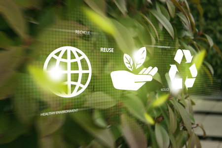 Ecological waste management concept. 3 recycle icons on green foliage bokeh background.の写真素材