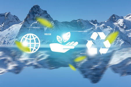 Reduce, reuse, recycle symbol in the middle of blue snowy mountain peaksの写真素材