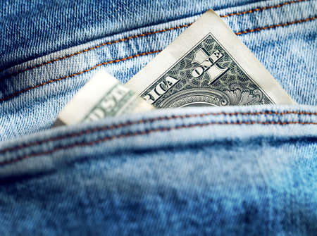 one dollar in the pocket of jeans. abstract photographyの写真素材