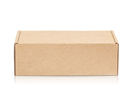 closed cardboard box highlighted on a white background.  With shadow and reflectionの写真素材