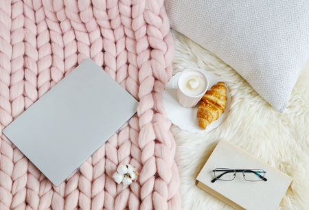 Cup with cappuccino, pink pastel giant plaid, fur, bedroom, morning conceptの写真素材