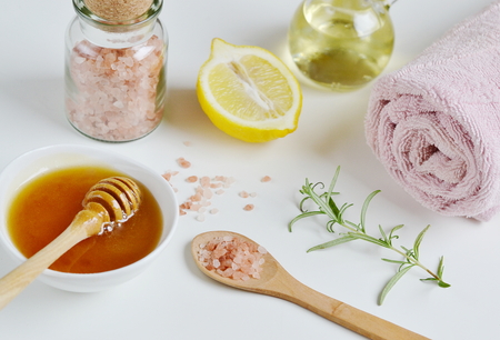 Natural Ingredients for Homemade Body Salt Scrub Honey Lemon Rosemary Salt Olive Oil Pink Towel Beauty Concept Skincare Organicの写真素材
