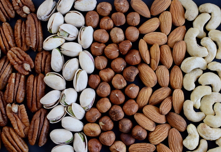 Assorted mixed nuts, peanuts, almonds, walnuts, pistachios, pecan, cashew, hazelnuts. Healthy food...