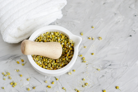 Dried chamomile flowers, natural ingredients for homemade body, face salt scrub, mask, SPA conceptの写真素材