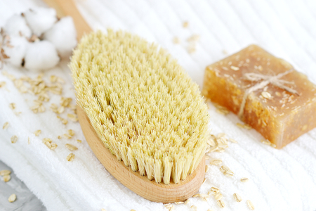 Natural Ingredients for Homemade Body Oatmeal Scrub Soap White Towel Beauty Concept Skincare Organic Wooden Body Massage Brush Aroma Spa Therapy Cotton Flowerの写真素材