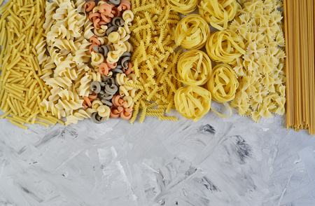 Different mix pasta types on the table, easy food concept, dinner time, homemadeの写真素材
