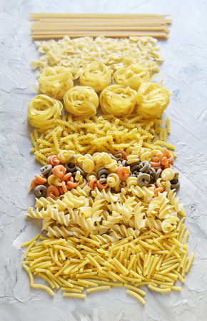 Different mix pasta types on the table, easy food concept, dinner time, homemadeの写真素材