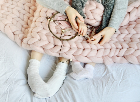 Morino Family Dreamcatcher Mother and Daughter Sitting on the Bedの写真素材