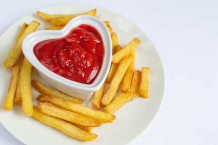 Valentines day, Tasty french fries on white plate