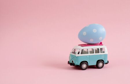 Riga, Latvia - March 04 2019: Hippie Bus with Easter Eggs on the Roof Miniature Small Car Bannerのeditorial素材