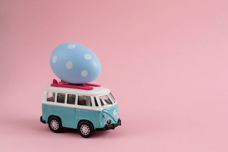 Riga, Latvia - March 04 2019: Hippie Bus with Easter Eggs on the Roof Miniature Small Car Bannerのeditorial素材