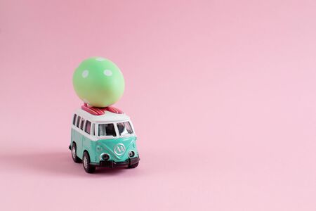 Riga, Latvia - March 04 2019: Hippie Bus with Easter Eggs on the Roof Miniature Small Car Bannerのeditorial素材