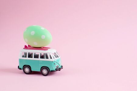 Riga, Latvia - March 04 2019: Hippie Bus with Easter Eggs on the Roof Miniature Small Car Bannerのeditorial素材
