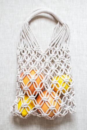 Handmade macrame shopping bag on the light backgroundの写真素材
