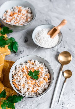 Pearl barley porridge with carrots, healthy food concept, breakfastの写真素材