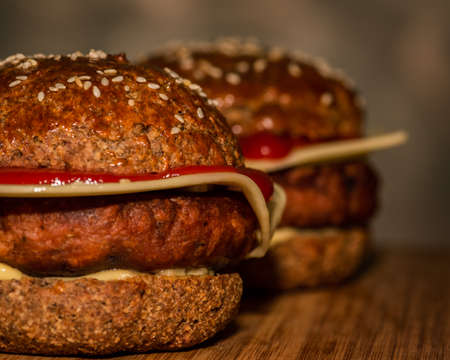 Healthy vegan burger and cheese in keto protein buns, vegetarian gluten free foodの写真素材
