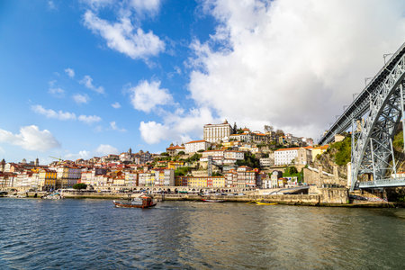 Porto, Portugal - NOVEMBER 05, 2019: Top view of buildings with red roofs in the city center of Porto, photo taken at the clÃ©rigos church, with sunbeamのeditorial素材