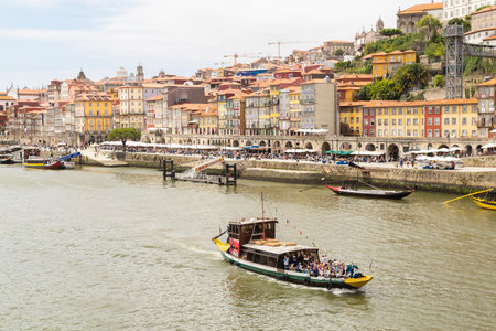 City of Porto, overlooking the Douro river and barta crossing the river.の写真素材