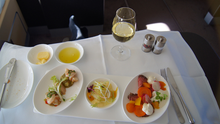 This is Lufthansa First Class dining onboard an Boeing 747-400 upper deck.の写真素材