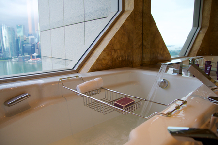 SINGAPORE - JULY 23rd, 2016: luxury Hotel room with modern interior, beautiful Large bathroom with marble.のeditorial素材