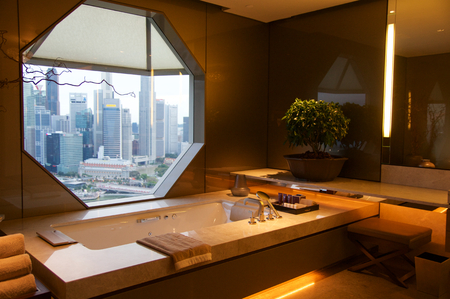 SINGAPORE - JULY 23rd, 2016: luxury Hotel room with modern interior, beautiful Large bathroom with marble.のeditorial素材