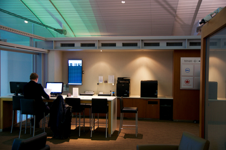 TORONTO, CANADA - JAN 28th, 2017: Air Canada Maple Leaf Lounge at YYZ airport International, business center with man working on a notebook, airport interior for frequent flyerのeditorial素材