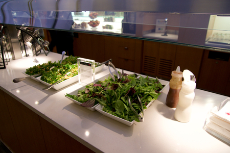 TORONTO, CANADA - JAN 28th, 2017: Air Canada Maple Leaf Lounge at YYZ airport International, buffet with salad, airport interior for frequent flyer.のeditorial素材