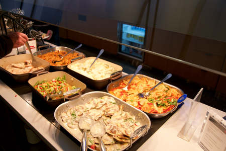 TORONTO, CANADA - JAN 28th, 2017: Air Canada Maple Leaf Lounge at YYZ airport International, eating area with a buffet with a choice of hot meals, airport interior for frequent flyer.のeditorial素材