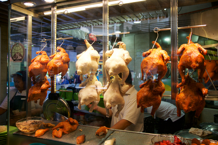 SINGAPORE - JULY 23rd, 2016: duck grilled or roasted hanging in cupboard-glass at Lau Pa Sat Festival Marketのeditorial素材