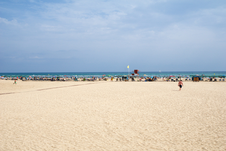 CAMBRILS, SPAIN - AUG 27th, 2017: Sandy beach on the Costa Daurada in the province of Tarragona, Cataloniaのeditorial素材