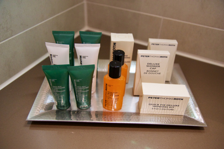 MAINZ, GERMANY - JUL 7th, 2017: Shower amenity set at a luxury hotel, A bar of soap, shampoo and body lotionのeditorial素材