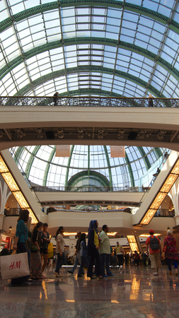 DUBAI, UNITED ARAB EMIRATES - MARCH 30th, 2014: Shoppers at Mall of the Emirates in Dubai. Mall of the Emirates is a shopping mall in the Al Barsha districtのeditorial素材