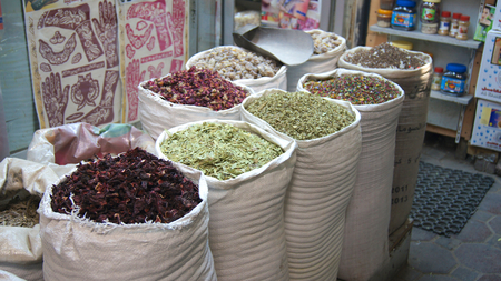 DUBAI, UNITED ARAB EMIRATES - MARCH 31st, 2014: Colorful spices on the traditional arabian souk market in Deiraのeditorial素材