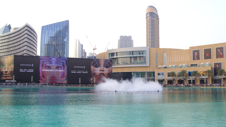 DUBAI, UNITED ARAB EMIRATES - MARCH 31st, 2014: The Dubai Fountain is the world's tallest performing fountain in Downtown Dubai next to gigantic mall. The popular musical fountain of Dubai are one of the most visited attractions of the arab city.のeditorial素材