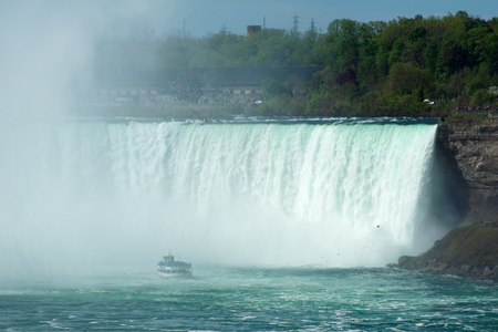NIAGARA FALLS, ONTARIO, CANADA - MAY 20th 2018: Touristic boat on Horseshoe Falls, also known as Canadian Fallsのeditorial素材