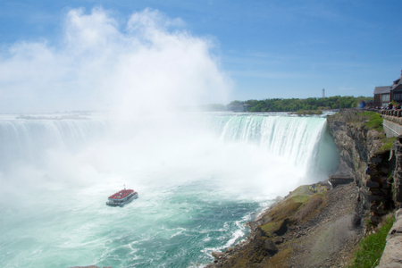 NIAGARA FALLS, ONTARIO, CANADA - MAY 20th 2018: Touristic boat on Horseshoe Falls, also known as Canadian Fallsのeditorial素材