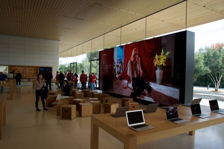 CUPERTINO, CALIFORNIA, UNITED STATES - NOV 26th, 2018: Interior with many customers in the new Apple store and Headquarters of Apple Park Visitor Center, Tantau Avenue, Cupertino, Silicon Valleyのeditorial素材