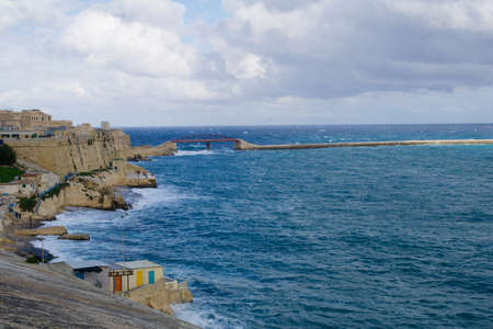 VALLETTA, MALTA - DEC 31st, 2019: View from Fort St Elmo on Red and Green Lighthouse pier light at the harbour entrance of grand Harbour Valletta Maltaのeditorial素材